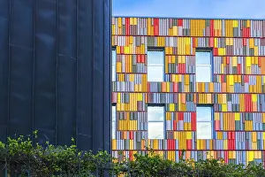 Contemporary Building Style Prints: Striking image of a modern building facade featuring a vibrant array of multicolored panels