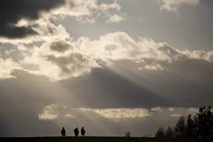 East German Scenery Prints: Stroller, sunbeams breaking through clouds