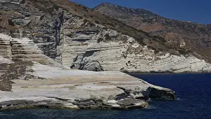Southeastern European Coastlines Prints: Structured rocks with limestone layer on the seashore in hilly terrain