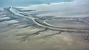 Top Down View Of Coastline Prints: Structures in the sand formed by wind and water