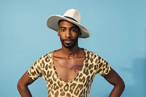 One Person Studio Photo Prints: Stylish guy posing in studio against blue background looking at camera