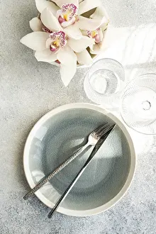 Elegant Table Setting Prints: Stylish table setting features a textured ceramic plate