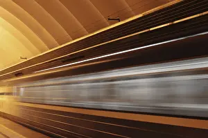 Public Transport Hub Prints: Subway platform with moving fast train