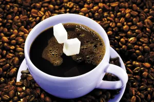 Hot Beverage Studio Shot Prints: Sugar cubes falling into a cup of coffee