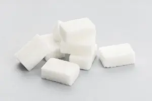 Gray Background Food Photography Prints: Sugar cubes on gray background. Close up