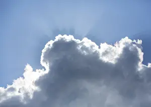 Empty Blue Skies Germany Prints: Sun behind a cloud in the blue sky