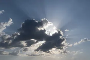 Desolate Landscape Prints: Sun behind a cloud with rays of light