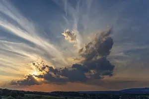 Central Europe Cloudy Skies Prints: Sun and clouds in the evening sky