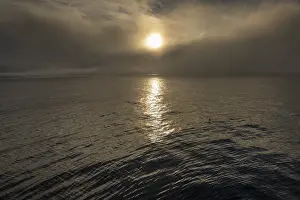 Northern European Coastline Prints: Sun behind clouds, sea surface