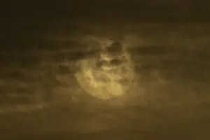 Cloudy Skies England Prints: Sun behind thin clouds in the sky