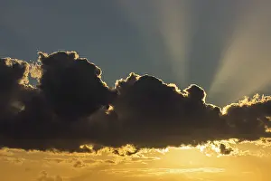 Deserted Evening Atmosphere Prints: Sun behind dark cloud, Germany