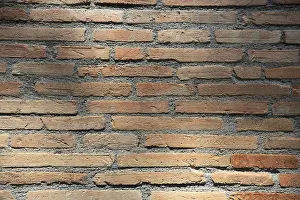 Empty Construction Site Images Prints: Sun-drenched brick wall with horizontal lines