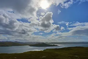 British Countryside Landscape Prints: Sun rays break through the clouds over a calm lake