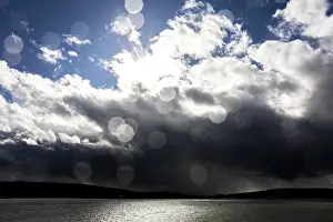 Prints of Sun rays break through dramatic clouds over the water, Seegarten, Allensbach, Lake Constance, Baden-Wurttemberg, Germany Sun rays break through dramatic clouds over the water, Seegarten, Allensbach Shining Sunbeam Prints: Sun Rays Break Through Clouds Print