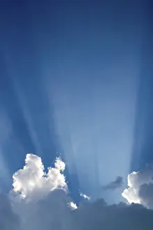 Cloudy Atmosphere Prints: Sun rays behind clouds
