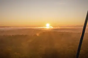 Morning Light In Southern Germany Prints: The sun rises over misty forests