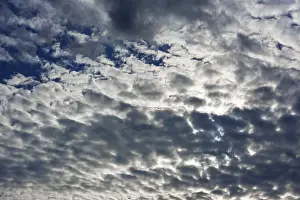 Cloud Formation Europe Prints: Sun setting behind the cloud cover, Austria