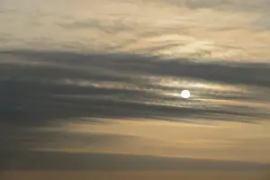 Cloud Formation Photography Prints: Sun shines behind layered clouds