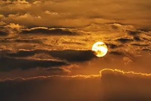Sun Shining Through Clouds Prints: Sun shining through clouds, evening sky