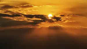 Sun Shining Through Clouds Prints: Sun shining through clouds, sun rays in the evening sky