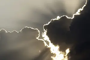 Stormy Weather Prints: Sun behind storm clouds