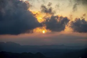 Prints of Sun at sunset with dark clouds, San Marino San Marino Prints: San Marino Sunset Print with Dark Clouds