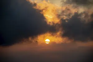 Prints of Sun at sunset with dark clouds, San Marino San Marino Prints: San Marino Sunset Print with Dark Clouds
