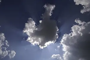 White Clouds Prints: Sun behind white clouds