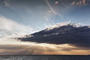 Northern Europe Sunset Photography Prints: Sunbeams behind clouds, dramatic evening sky
