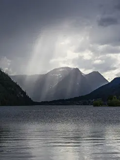 Images Dated 18th May 2024: Sunbeams Fall from Thunderclouds Print, Grundlsee, Austria