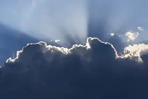 Light Beam Photography Prints: Sunrays behind a cloud, Germany
