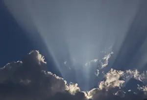 Cumulus Humilis Cloud Prints: Sunrays behind a dark cumulus cloud, Germany