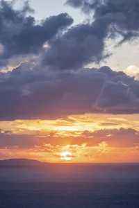 Cloudy Sky Greece Prints: Sunrise behind the clouds, atmospheric dramatic cloudy sky