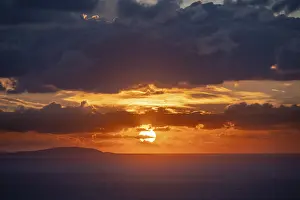 Cloudy Sky Greece Prints: Sunrise behind the clouds, atmospheric dramatic cloudy sky
