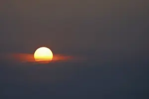 Cloudy Morning Sky Prints: Sunrise, sun emerging from a gap in the clouds