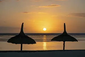 Prints of Sunset on the beach, umbrellas, Flic En Flac, Mauritius Mauritius Prints: Sunset on the Beach, Flic En Flac, Mauritius Print