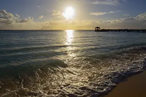 Caribbean Sunset Prints: Sunset on the beach with a view of a jetty