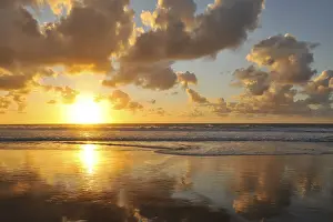 Evening Sun Over Water Prints: Sunset and clouded sky reflected in the Atlantic Ocean