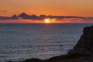 Cloudy Sky Landscape Prints: Sunset behind clouds on the Atlantic Ocean