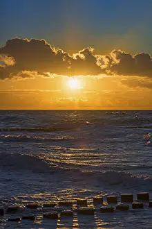 Evening Sun Backlight Shot Prints: Sunset with clouds over the Baltic Sea