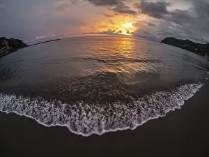 Dramatic Cloudy Atmosphere Prints: Sunset behind clouds over the sea