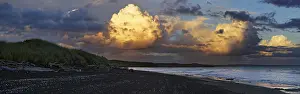 Deserted Sandy Shoreline Prints: Sunset at the dark sandy beach