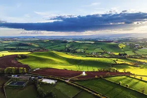 Atmospheric Drone Image UK Prints: Sunset of Devon Windmill over Fields and Farms from a drone