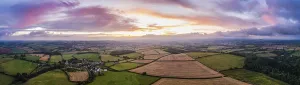 Remote Controlled Aircrafts Prints: Sunset over the fields from a drone