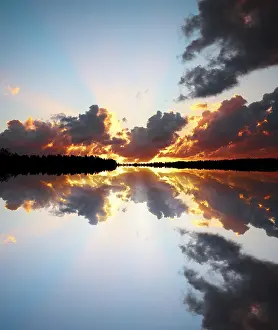 Cityscape At Dusk Prints: Sunset over lake