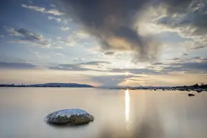European Nature Landscapes Prints: Sunset over a lake, dramatic clouds form in the sky