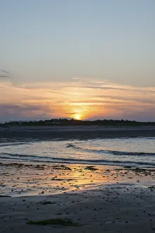 German Beach Scene Prints: Sunset on a quiet beach with soft light on the waves