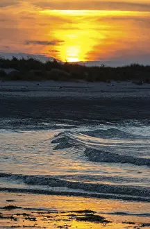 Low Tide Beach Scene Prints: Sunset on a quiet beach with soft light on the waves