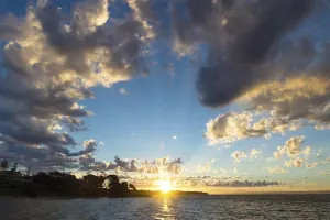 Deserted Beach At Sunset Prints: Sunset with rays and round cloudscape on blue sky at Cowes