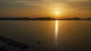 Balkan Peninsula Coastline Prints: The sunset is reflected in the sea